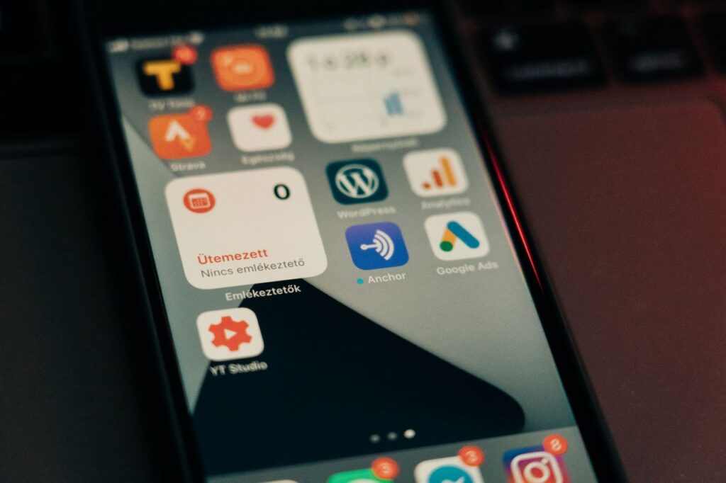 Close-up of a smartphone screen showing apps and notifications