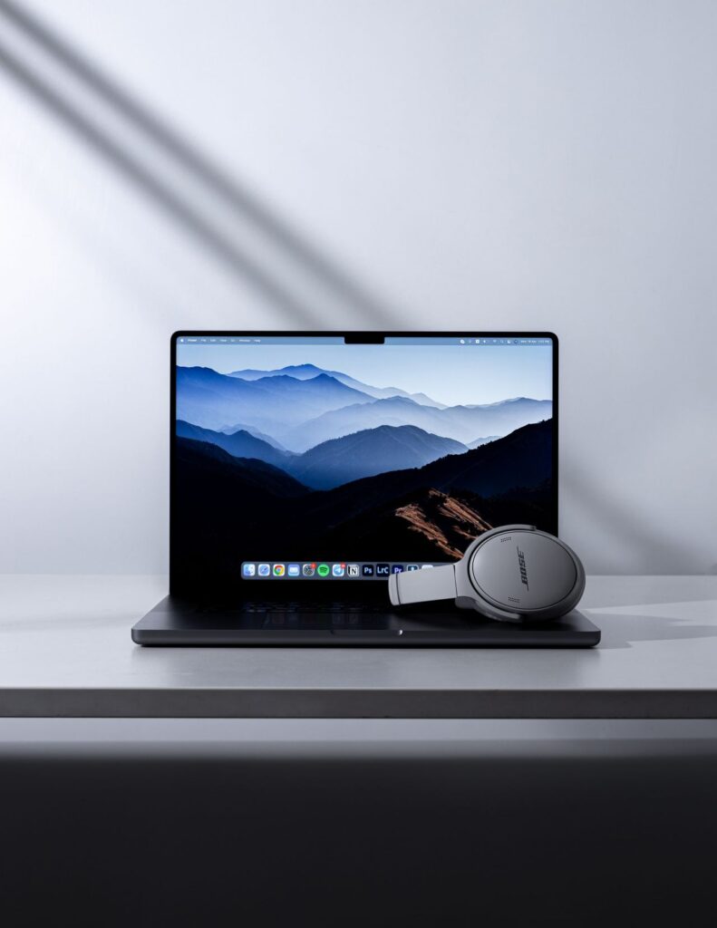 Laptop with headphones on a clean desk