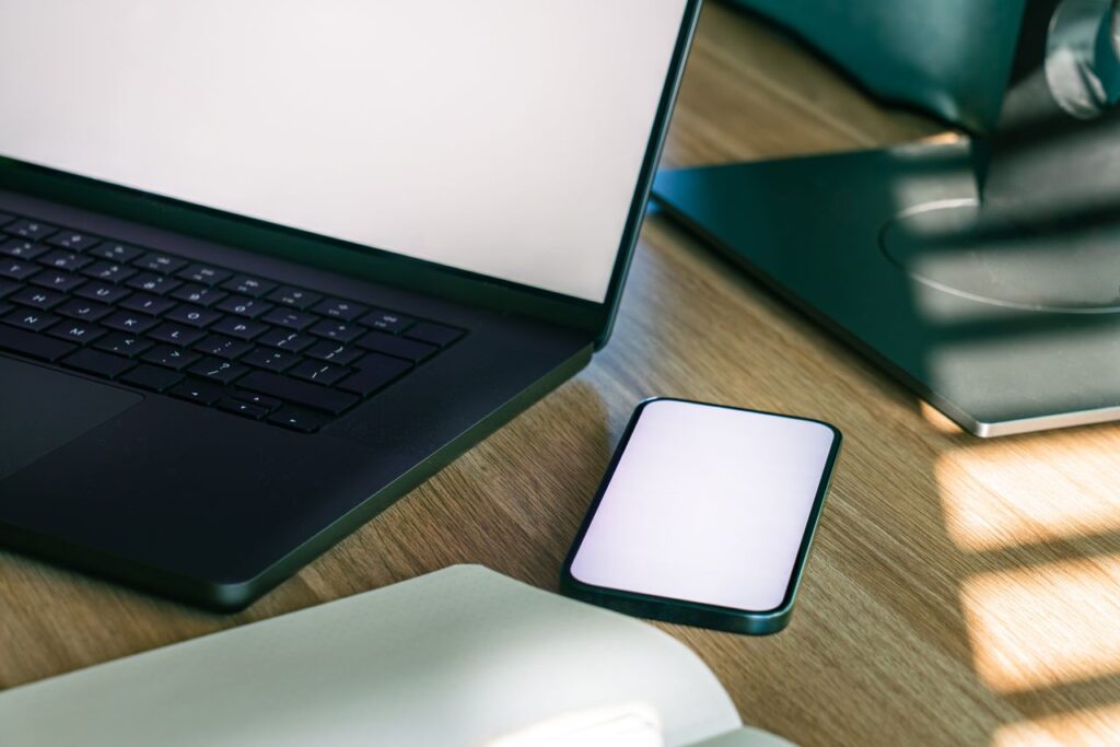 Office workspace with a laptop and smartphone