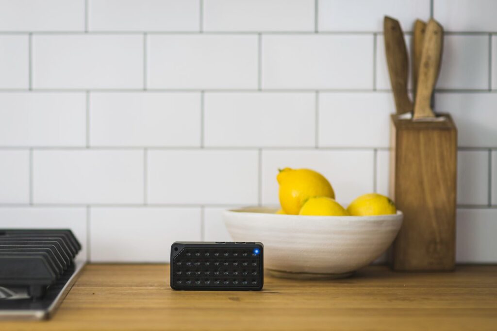 Portable speaker on a table indoors