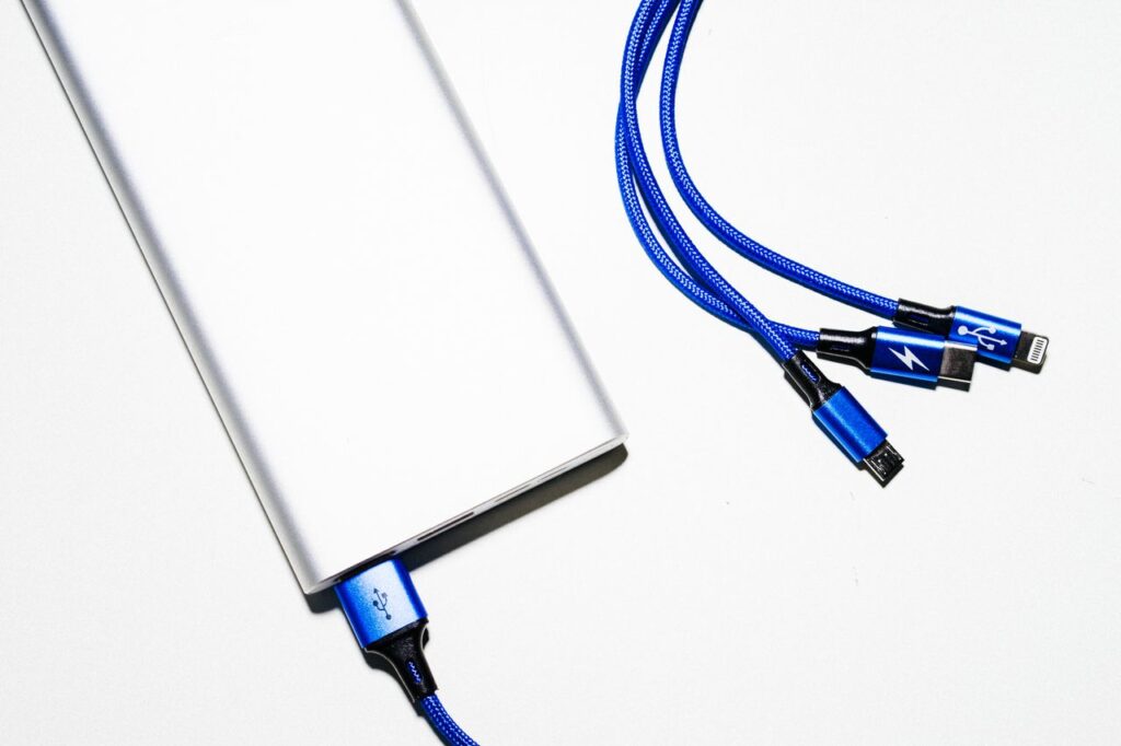 Power bank with blue USB charging cables