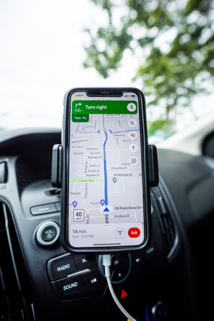 Smartphone with a navigation app mounted in a car