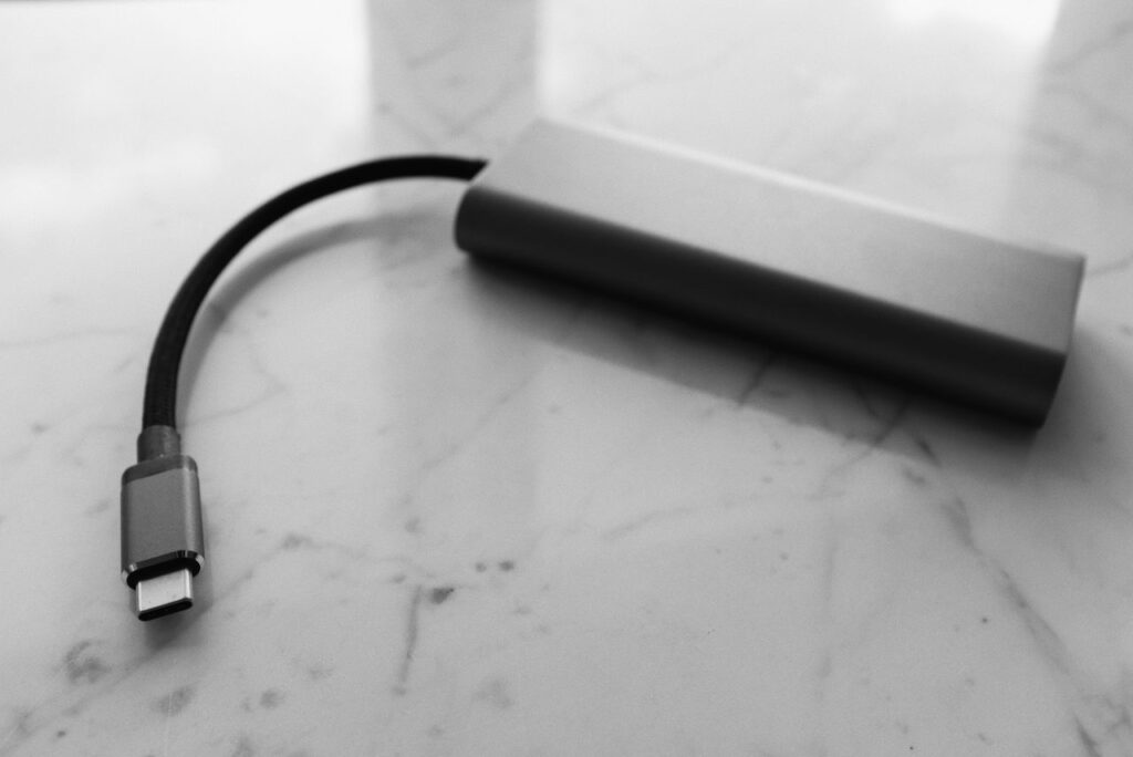 USB-C power bank and cable on a marble surface